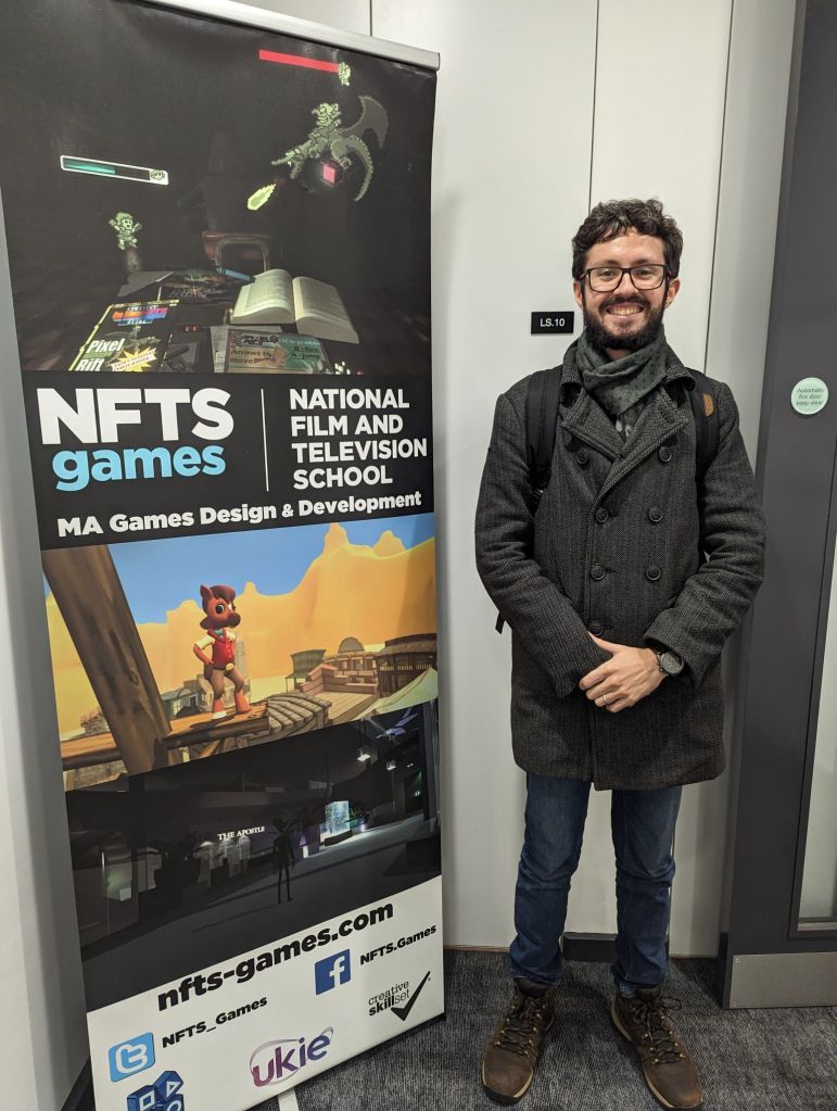 GTM's Hamilton Morrin next to a banner for the NFTS games course